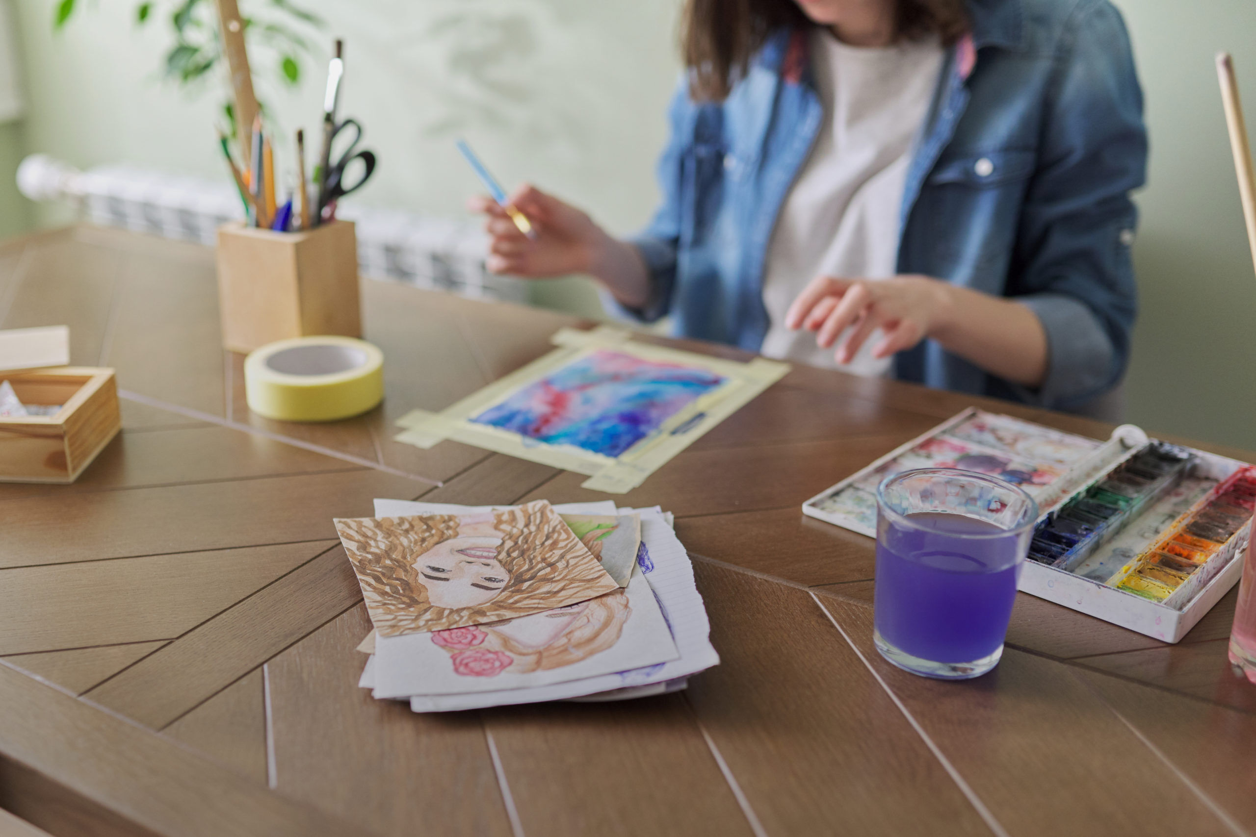 teenager-girl-painting-with-watercolors-sitting-at-home-at-the-table-art-education-creativity-teenage-hobbies